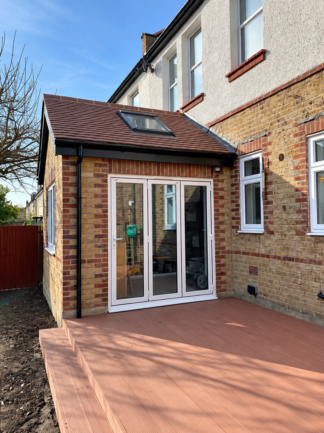 Sharpened rear extension with rooflight and glazed doors
